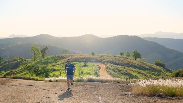 Brazilian man engaged in outdoor running, surrounded by scenic mountain landscapes. The image inspires those seeking well-being and health through physical exercise.
