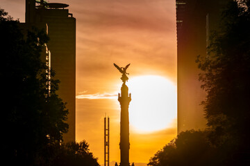 The Angel of Independence statue placed on Promenade of the Reform in Mexico city between tall...