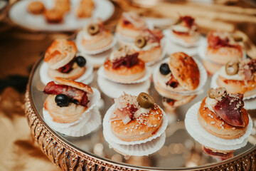 several snacks on a table, at a luxurious party