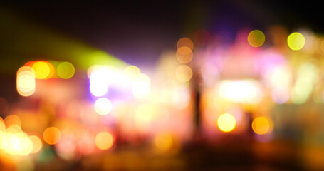 Vibrant Bokeh abstract blurred background music festival stage show performance party. Colorful...
