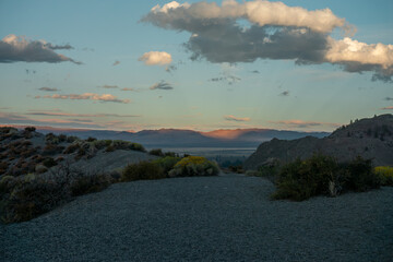 A mountain view with the sun setting in the distance at Mono Lake.