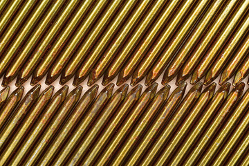 Closeup of rows of resin coated framing nail point