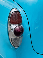 Tail Light On A Classic Blue Sedan