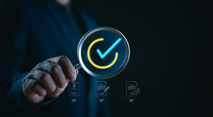 Businessman hand holding magnifier glass for quality control concept, Quality management with Quality Assurance or QA and Quality Control or QC and improvement, Standardization and certification.