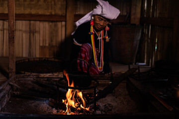 Grandma karen light the fire boil hot water in the kettle