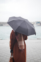 women under umbrella in the rain 