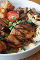  grill chicken meat served with salad on a plate 