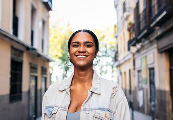 Portrait of a cheerful African American young woman outdoors