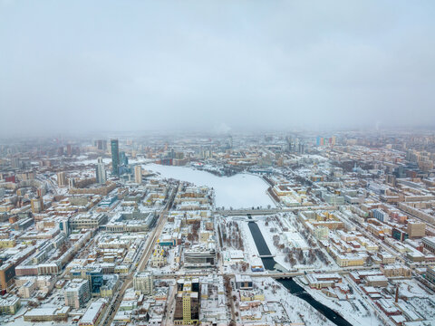 Embankment of the central pond and Plotinka in Yekaterinburg at winter sunset. The historic center of the city of Yekaterinburg, Russia, Aerial View