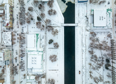 Embankment of the central pond and Plotinka in Yekaterinburg at winter sunset. The historic center of the city of Yekaterinburg, Russia, Aerial View