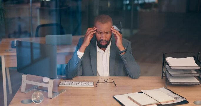 Business man, headache and pain in office for financial stress, accounting mistake or bankruptcy on computer. African accountant or corporate worker with migraine, burnout and fatigue for deadline