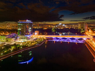 Fototapeta na wymiar Yekaterinburg city and pond aerial panoramic view at summer or early autumn night. Night city in the early autumn or summer.