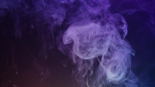 Smoke texture on black background in blue neon light. Smoking, steam clouds of vapour close-up. Burning, fog. 