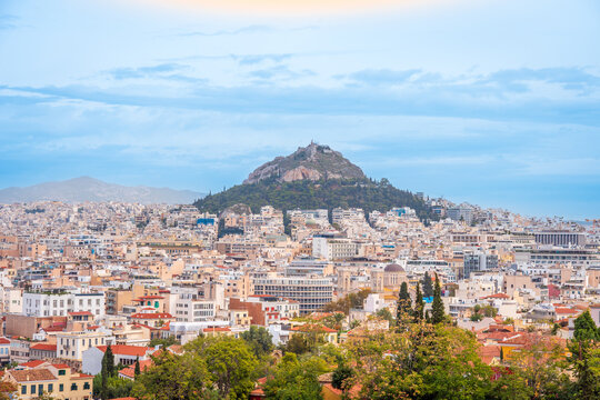 A hill top mountain rising above the city of Athens, Greece in Europe