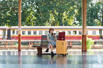 Woman using mobile phone while travel by train. travel concept