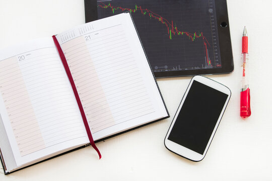 mobile phone, tablet and notebook planner for financial play the stock market 