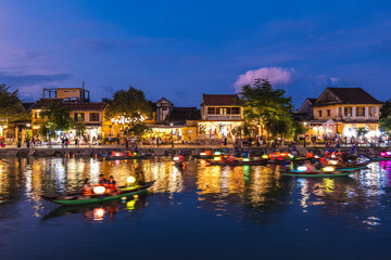 Scenery of Hoi An ancient town by Thu Bon River in Vietnam at night - obrazy, fototapety, plakaty