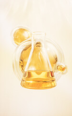 Chemical glassware with golden liquid, 3d rendering.