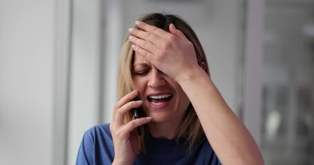 Blonde lady becomes upset talking on phone with partner
