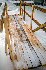 Temporary wooden bridge on a winter day