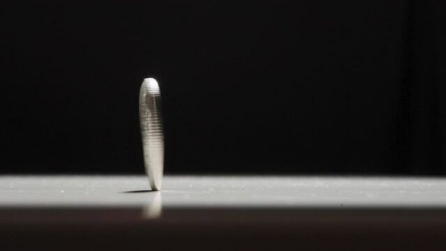 Swedish 1 Krona Coin Spinning on Table