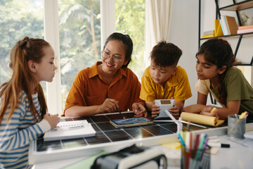 Curious kids learning about renewable energy in class