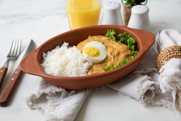 Aji de gallina chicken spicy cream served with rice traditional peruvian food