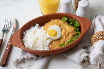 Aji de gallina chicken spicy cream served with rice traditional peruvian food