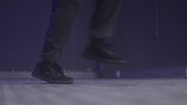 An Indian Hip hop Dancer got ankle sprain or twisted while practicing footwork or during dancing, closeup