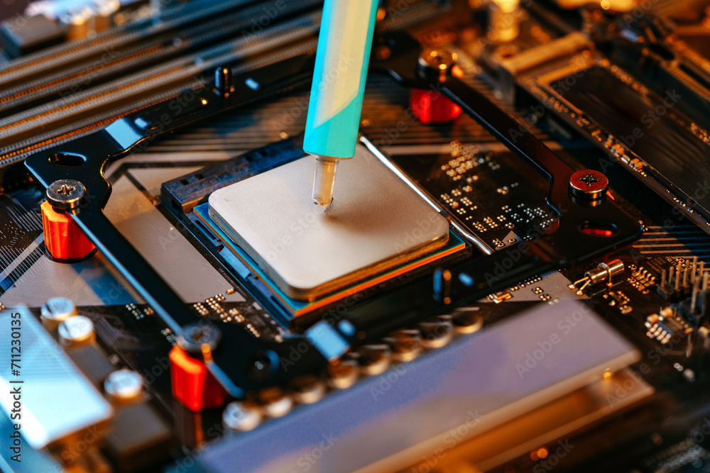 Poster applying thermal paste to a computer processor