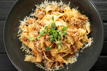 Italian Pasta Fettuccine with meat bolognese sauce and parmesan. High angel
