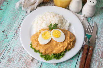 Aji de gallina chicken spicy cream served with rice traditional peruvian food