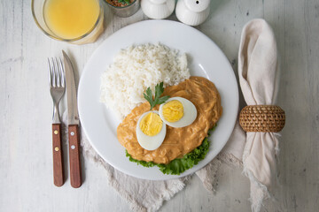 Aji de gallina chicken spicy cream served with rice traditional peruvian food