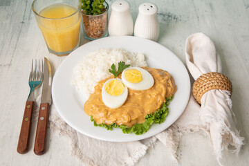 Aji de gallina chicken spicy cream served with rice traditional peruvian food