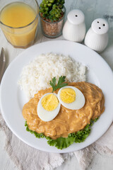 Aji de gallina chicken spicy cream served with rice traditional peruvian food