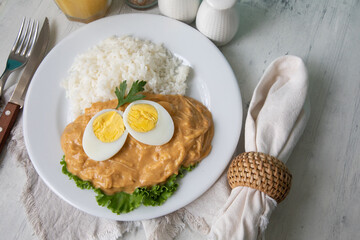 Aji de gallina chicken spicy cream served with rice traditional peruvian food