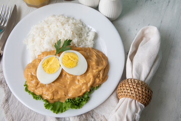 Aji de gallina chicken spicy cream served with rice traditional peruvian food