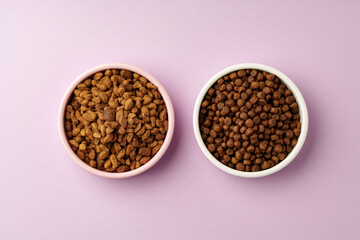 Cat food on pink background in studio