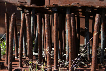 Rusty old metal engineering pipes no longer used and left to just rust in the elements.