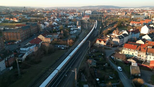 Drone Video of two ICE Trains crossing their way during sunset in Bamberg