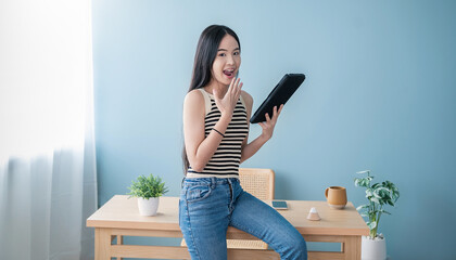 Portrait of young beautiful asian woman relax use smartphone gadget in office. Smile happy asian...
