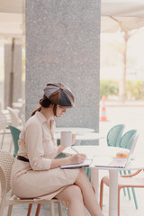 Portrait of Caucasian Female writer working outdoor 