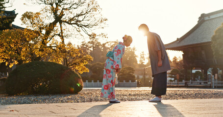 Japanese people at temple, bow and traditional clothes with hello, nature and sunshine with respect...