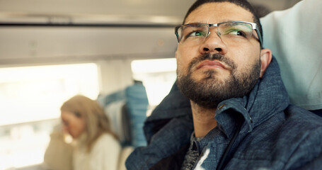 Thinking, idea and young businessman on a train for public transportation to work in the city....