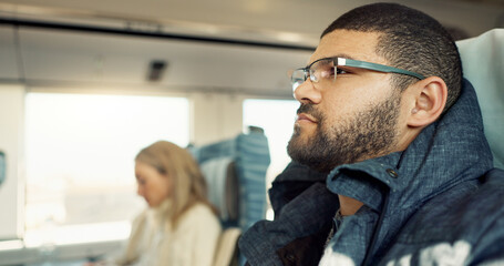 Thinking, idea and young businessman on a train for public transportation to work in the city....
