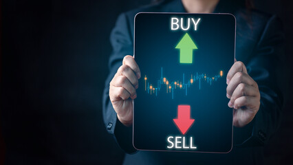 investment strategy and online trading trends - businessman's hand with tablet and stock graphs