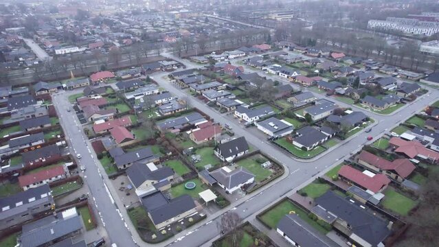 Aerial View Of Suburb Housing Surrounded By Park In Winter In Denmark.