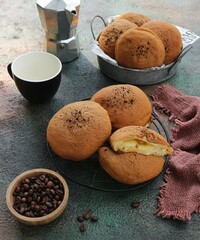 Coffee bread served on the table with coffee beans