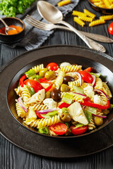 fusilli salad with mozzarella, veggies in a bowl