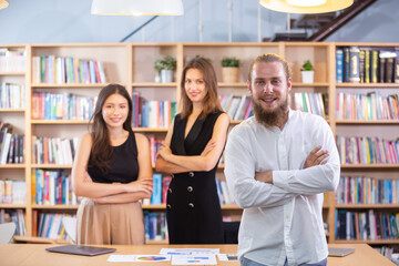 Portrait attractive businessman successful arms crossed with team people in office, Leadership are committed to corporate businessperson looking at camera.